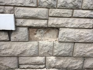 stone cladding onto of a real stone house