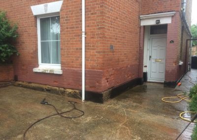 Textured coating concrete render causing damp and brick erosion