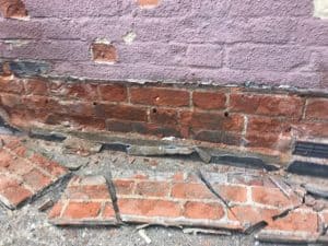 Cement render damage to bricks